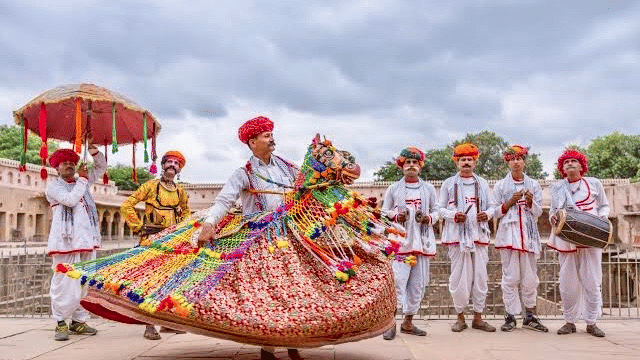 Traditional Rajasthani folk dancers performing at a wedding celebration at Umaid Palace.
