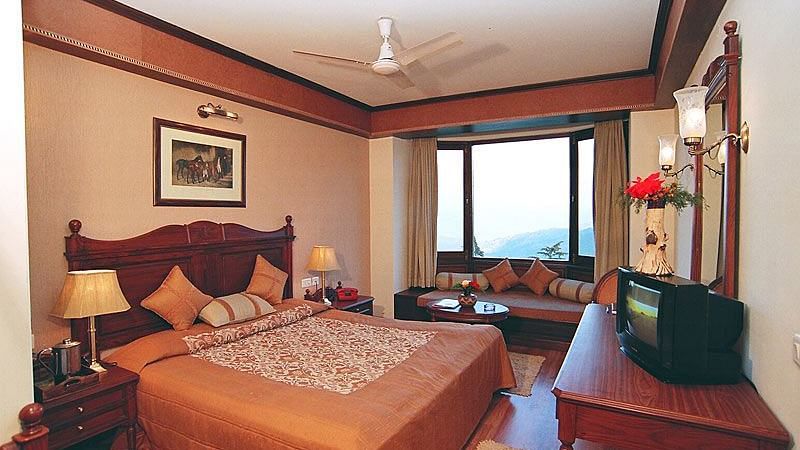 Picture of Cozy hotel room with a comfortable bed and soft curtains.