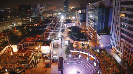 Aerial night view of the bustling CyberHub dining and entertainment plaza in Gurgaon.