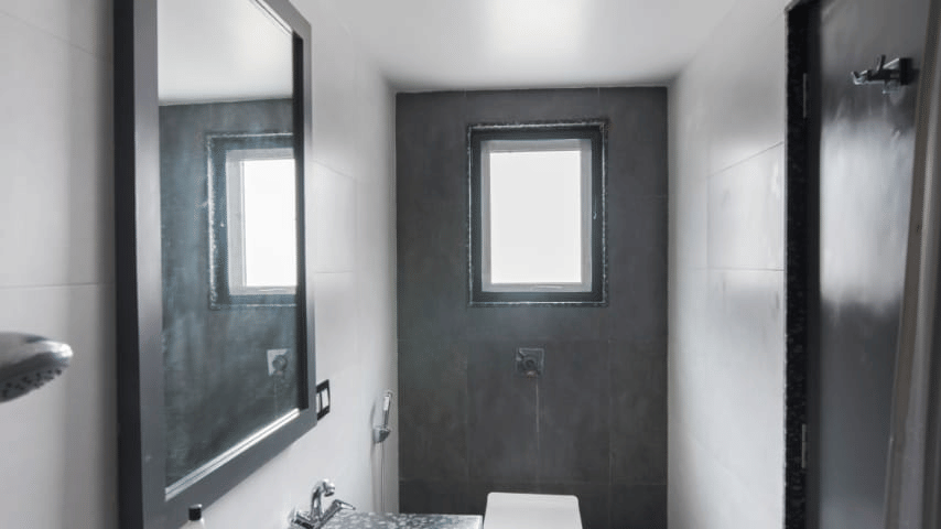bathroom with modern interiors and a big mirror and spacious sink.
