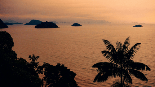 Tranquil tropical sunset over the beach at Sunrise Beach Resort Andaman.