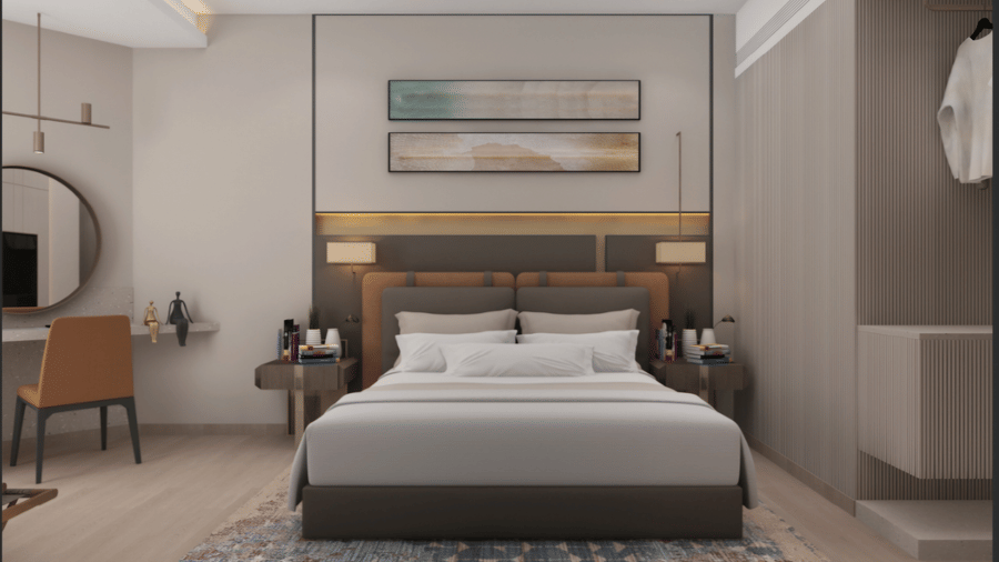 Executive Room at Tulip Inn Bidar with a double bed, 2 bedside tables with lamps, 2 wall artworks, a vanity desk, and an open wardrobe.