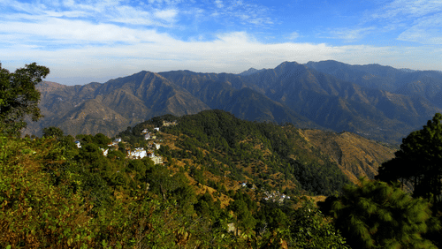 Green misty mountains under the dramtic cloud sky