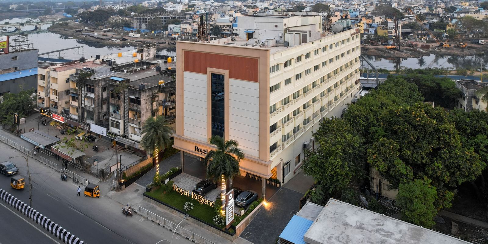 Aerial side view of the hotel surrounded by the cityscape at Hotel Royal Regency Chennai