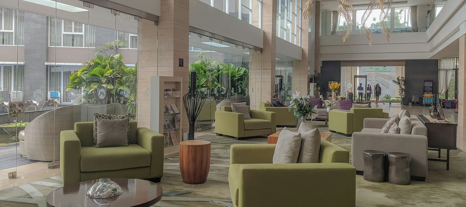 Lobby space with sofas with multiple pillows.