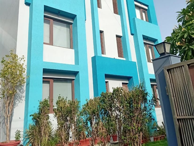 A modern building with balconies and a flat roof - Asian Suites IFFCO Chowk Metro Station, Gurgaon. 