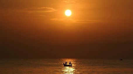 Scenic view of the beach at sunset.