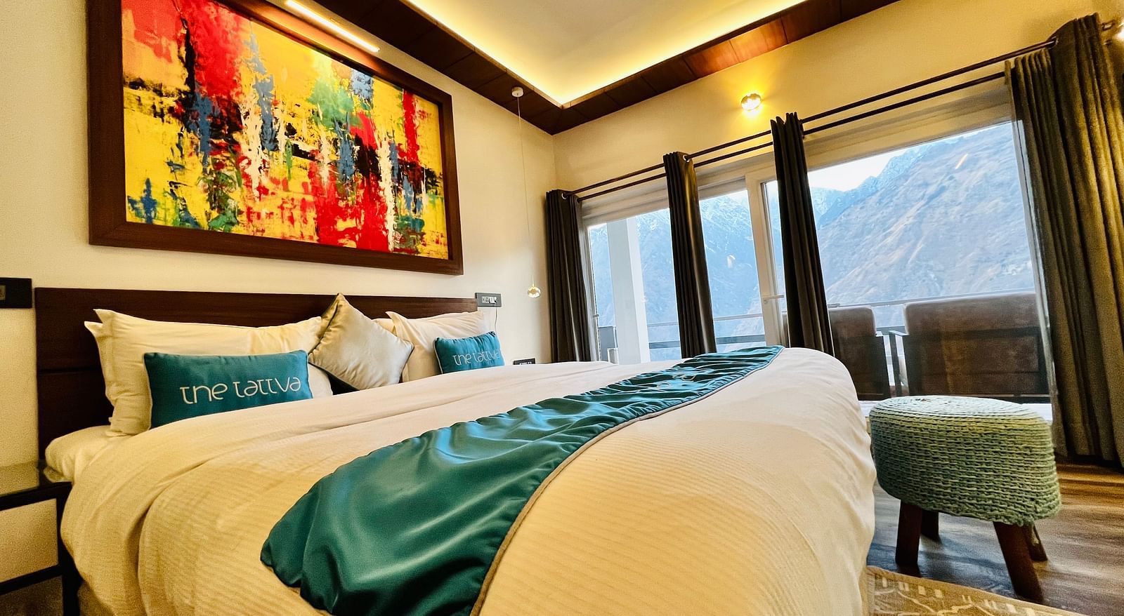 image of a double bed taken from a lower angle at the pent house - The Tattva Boutique Resort