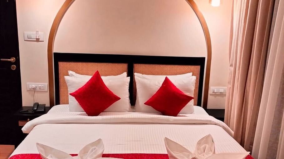 Deluxe room at Mademoiselle with red bedding