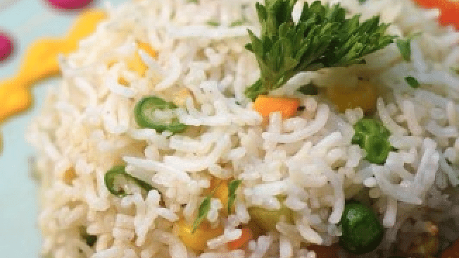 A beautifully plated dish with rice, meat skewers, and fresh herbs at Cenneys Gateway.