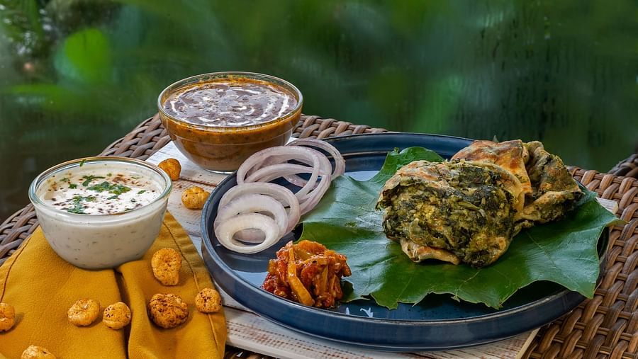  A delicious spread of Indian dishes, including thali, chaat, and desserts.