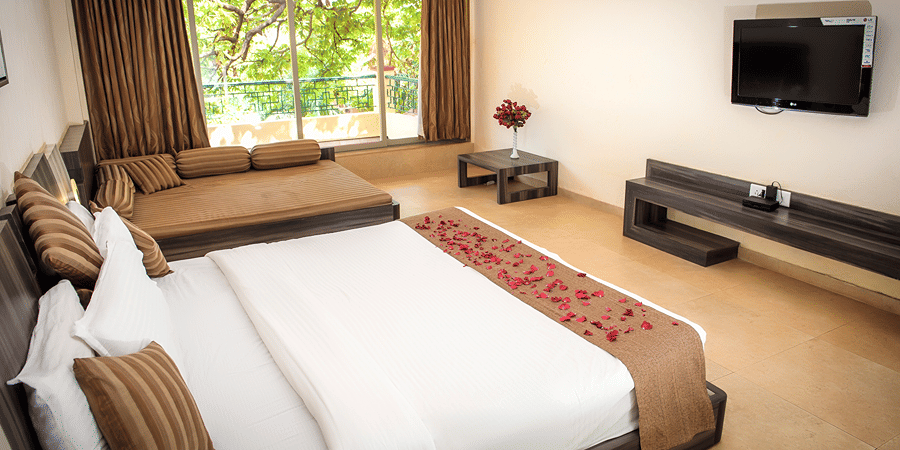 A view of the bed beside the window in Regency Room.