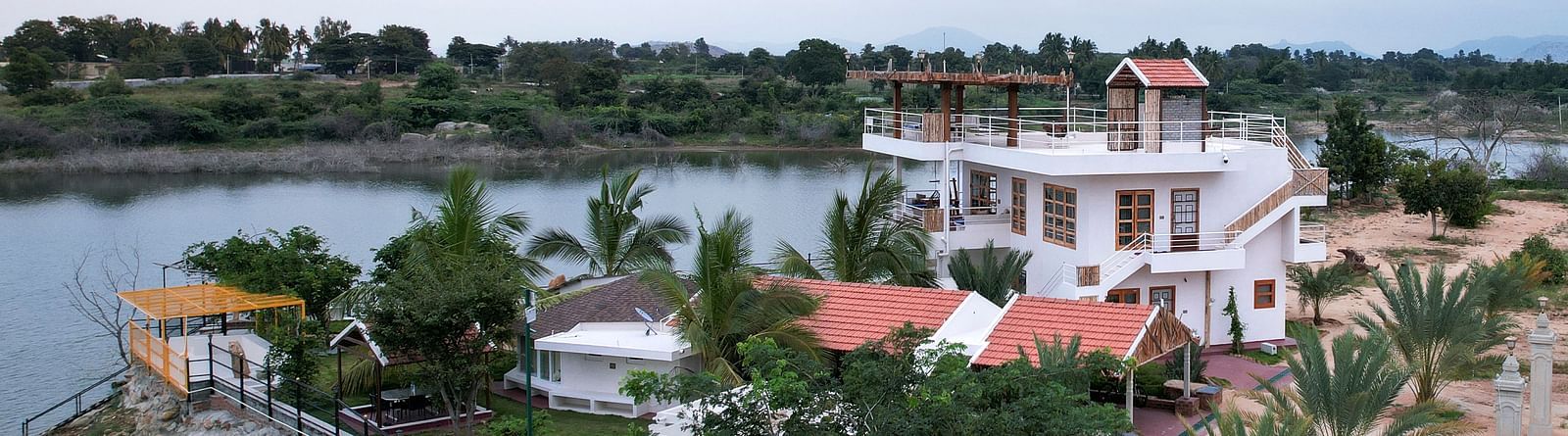 Birds eye view of a property next to  a water body