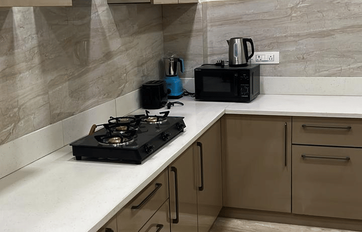 Kitchen area at Lime Tree 3BHK Serviced Apartments, DLF Phase - 5 Gurgaon