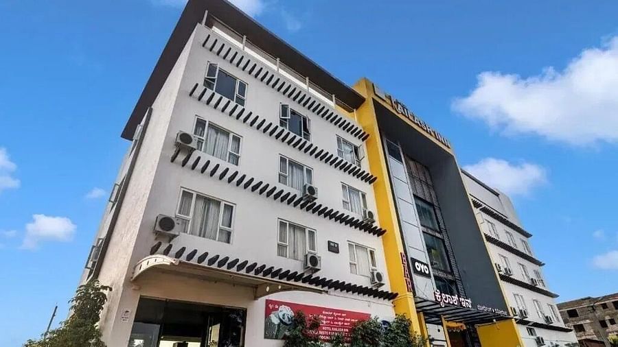 The exterior of a modern multi-story hotel building with yellow and grey accents under a blue sky - VITS Select Kailash Inn, Bagalkot