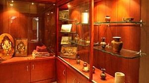 Numerous artifacts displayed with an elaborate lighting setup