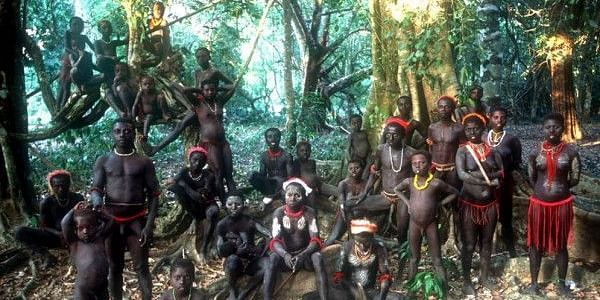 Tribal people in the Andaman Islands gathered in a group in the forest for taking a picture