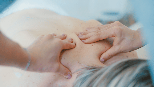 a person getting back pressed by a masseuse