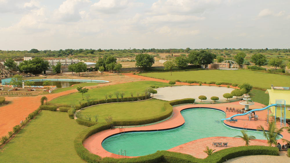 Landscaped grounds and party lawn at The Palm Resort, a luxury resort in Bhilwara