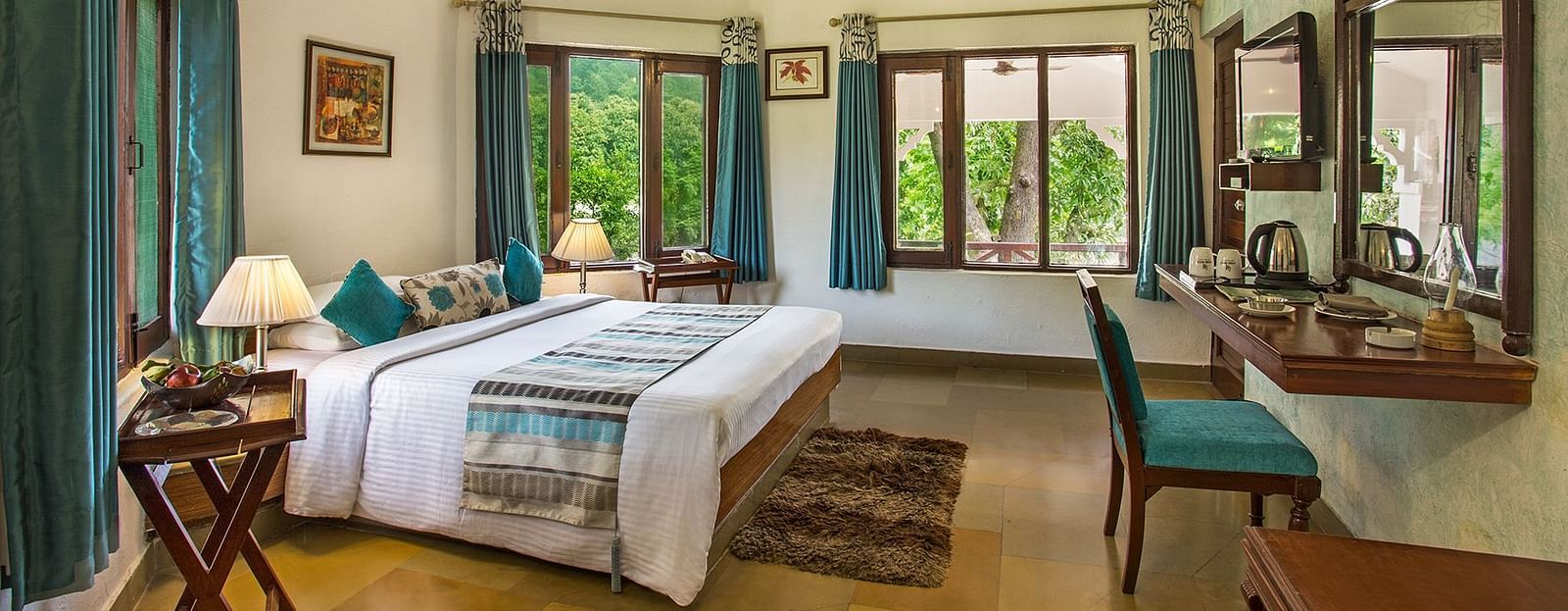 An image of a bedroom with king size bed, wooden ceiling where a fan is hanged,  cabinet and tables, etc. - The Riverview Retreat, Corbett