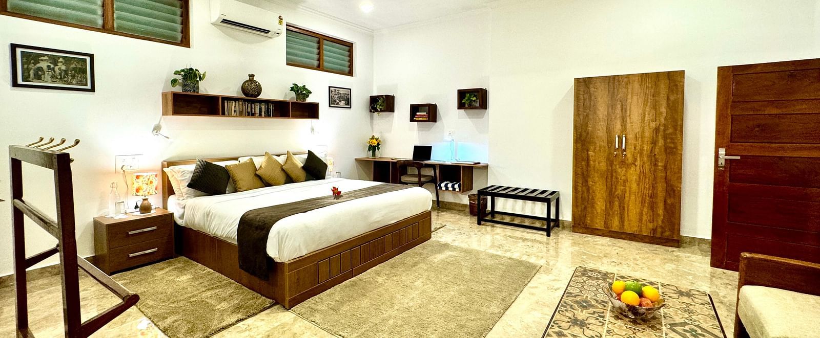 Another view of the bedroom showing a seating area and wardrobe - BluSalzz Collection - Tranquil Resort, Wayanad