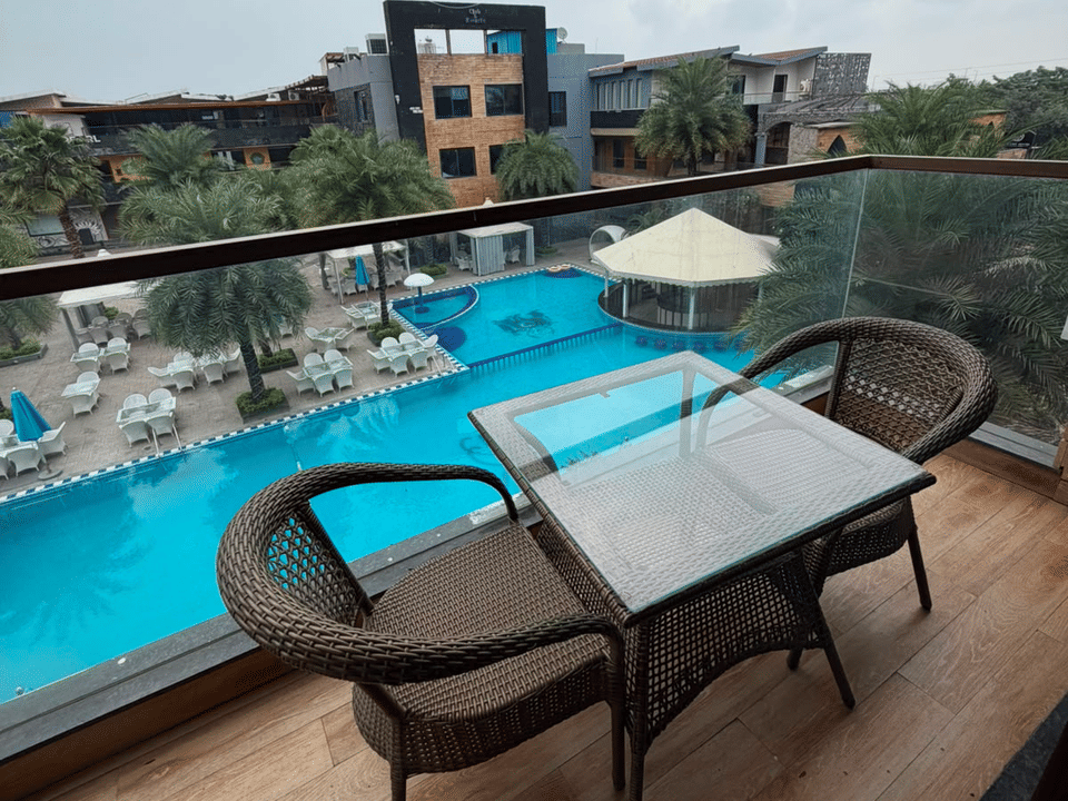Skyline by Miraya, Executive Room, Balcony table overlooking the pool