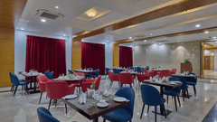 the indoor seating space at the restaurant - Golden Tulip, Tirupati 