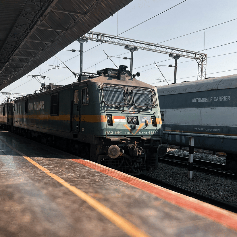 A train passing through the station, viewed from the platform.