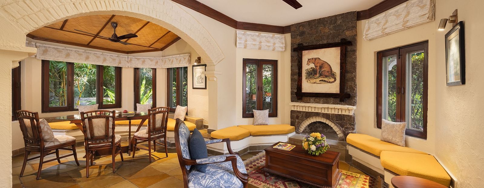 A comfortable living room area with a sofa, chairs, and a coffee table.