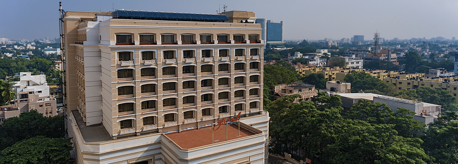 Facade view of Grand Chennai By GRT Hotels during day time.