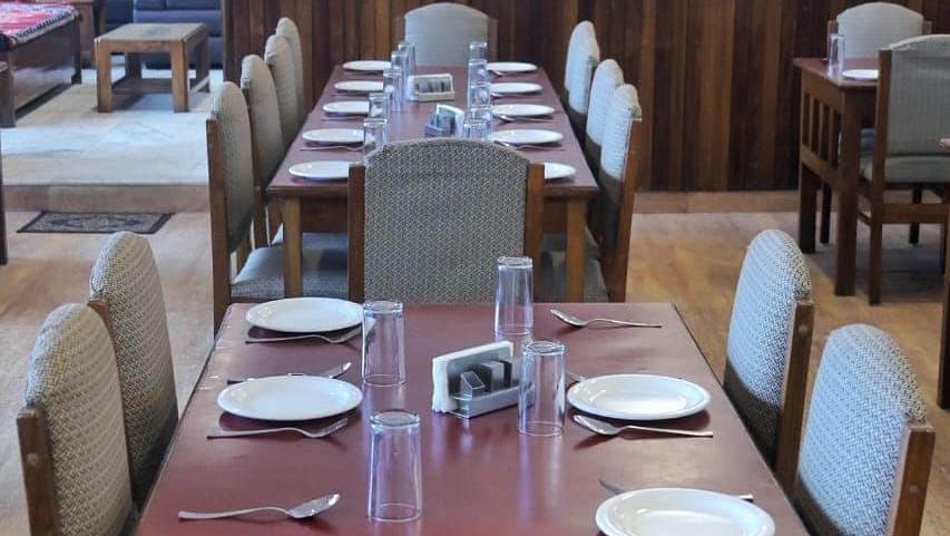 An image of the restaurant with its seating arrangement at Sumitel Chiminda, Pelling