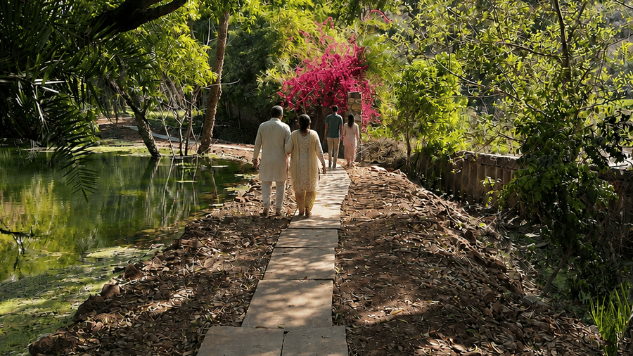 Indian family walking by the river