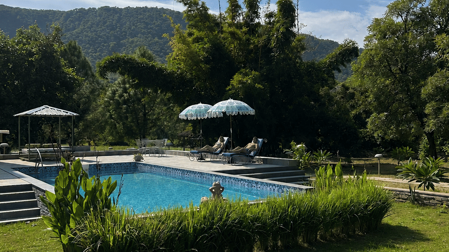 Sunny Poolside Retreat with Mountain Views-Surya Bagh