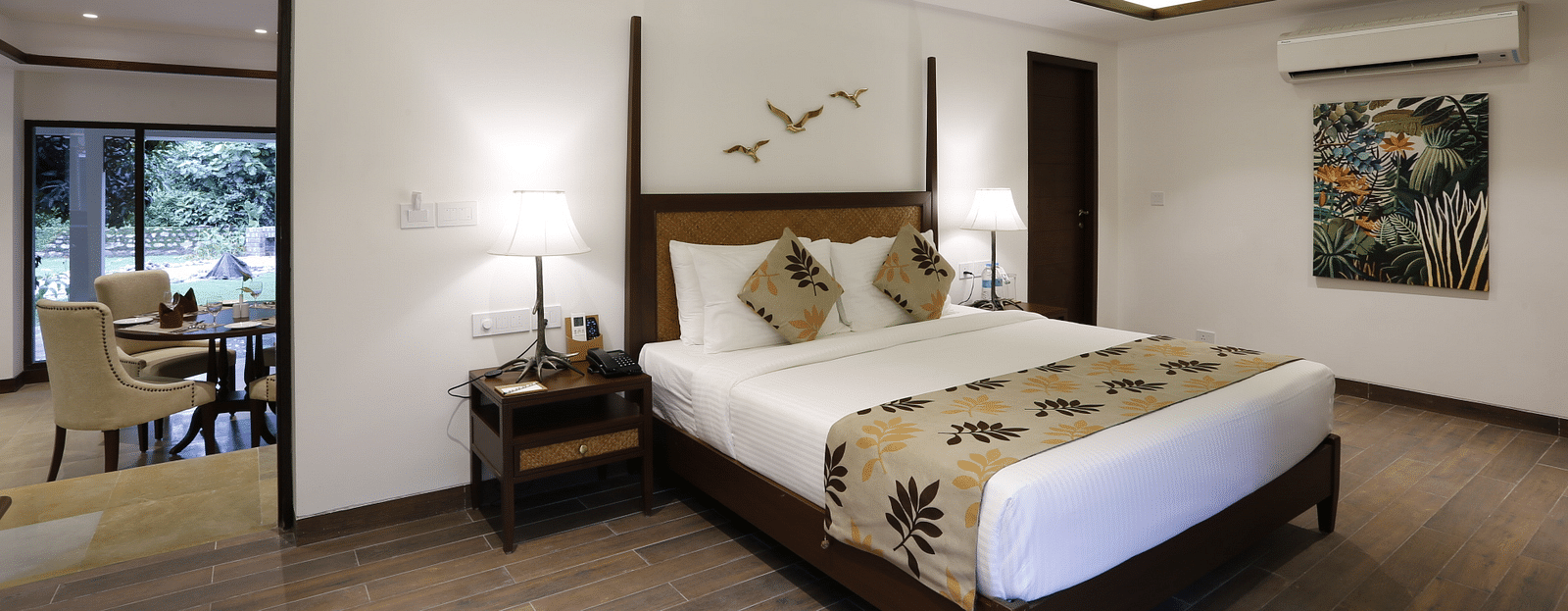 An image of a bedroom with double size bed, flat TV screen, and a bedside table with lamp - The Riverside Retreat, Corbett