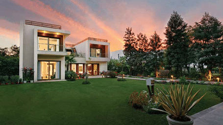 A facade view of a villa during twilight - Karma Lakelands.