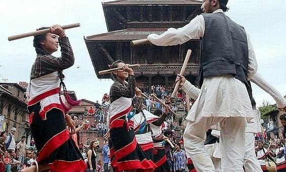 Men and women celebrating the Gai jatra festival