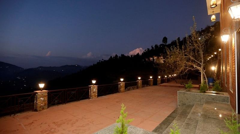 Walkway at Digantaa resort with lighted lamps