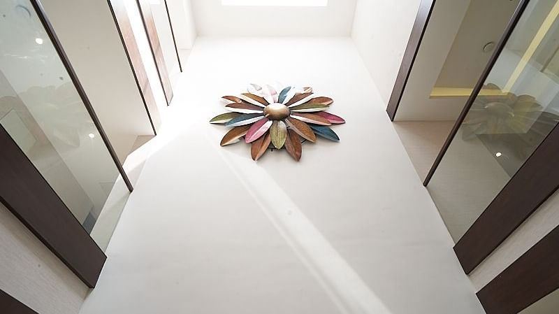 Interior design of The Hamuse Hotel, Kodaikanal showcasing a large flower centrepiece 