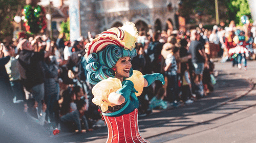 An image of a women dressed well in a parade.