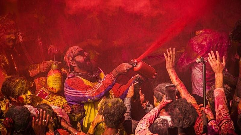 An image of a group of people enjoying with colours.