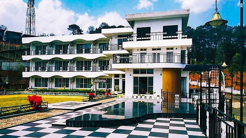 Facade of La Nicholas, Shillong with the swimming pool in the foreground