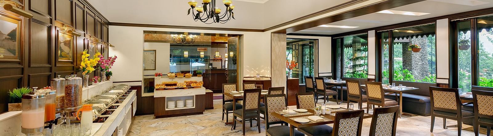 A resturant with chair and table well furnished and decorated 
