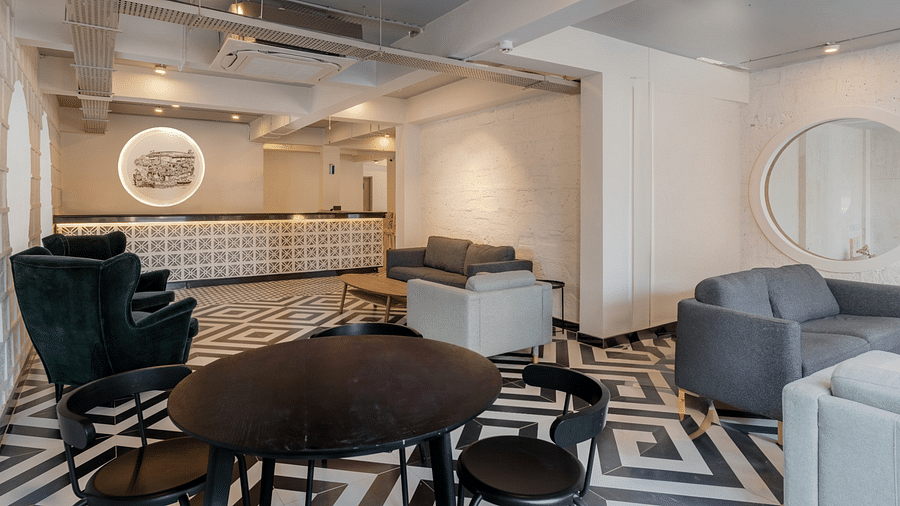 Modern lounge area with stylish furniture and monochrome decor. at Bedzzz Xclusiv Morjim, Goa