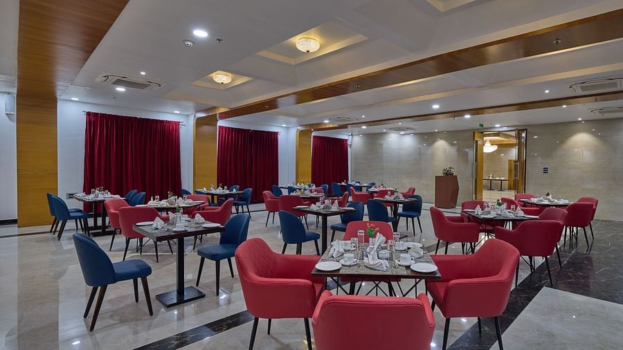 the indoor seating space at the restaurant - Golden Tulip, Tirupati  2
