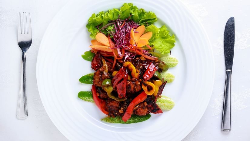 Image of a plate filled with variety of colour full dishes 