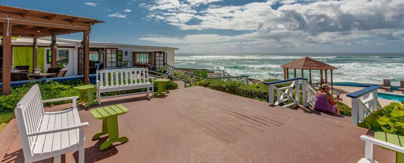 Brick-paved area with oceanfront view and patio seating | Abaco Inn