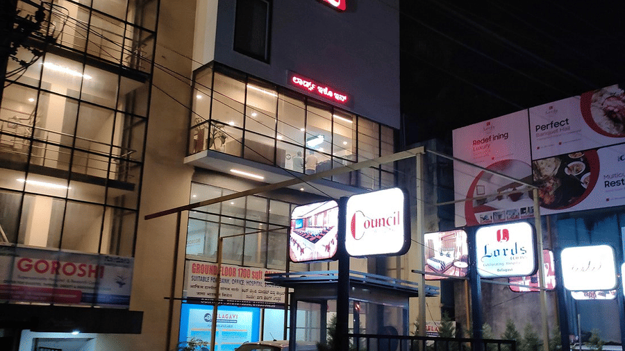 Facade image of our hotel in Belagavi taken during the night featuring the logo of the hotel above - Lords Eco Inn Belagavi