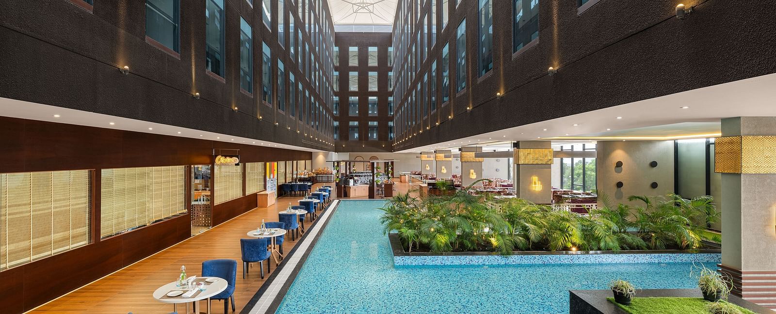 Blue Salt Cafe at Essentia Luxury Hotel, Indore with poolside seating arrangement