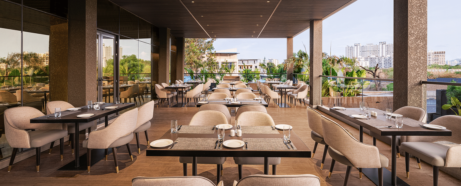 A view of dining area at Citron Bar with comfortable seating at Essentia Premiere, Pune.
