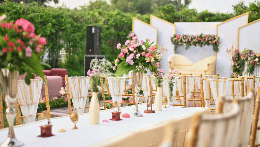 Banquet table arrangement at Marasa Sarovar Premiere, Bodhgaya with floral centrepieces, glassware and table linens